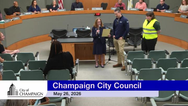 Mayor Feinen reading proclamation in front of Council Dais. 