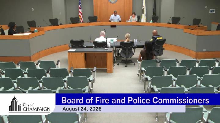 Wide Shot of Chambers with Two Commissioners at the Dias. 